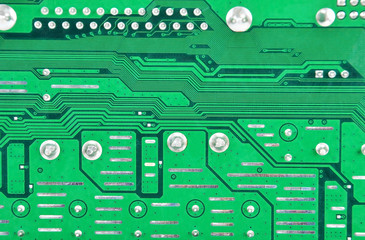 Close up of a printed green computer circuit board