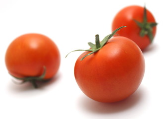 ripe tomatoes on white background