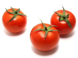 ripe tomatoes on white background