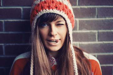 Portrait of young pretty funny smiling girl in cold weather
