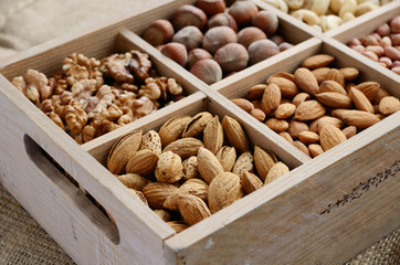 Nut mix in wooden box - walnut, almond, hazelnut, cashew and pea - 51209823