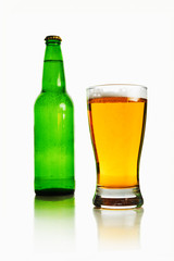 Beer bottle and glass full of light beer