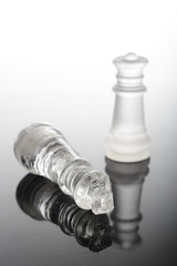Check mate Glass chess pieces with queen over king