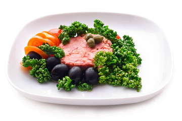 tuna fish with black olives, tomatoes and parsley closeup