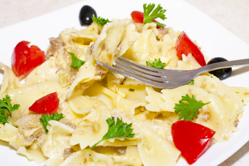 Pasta ribbons, cherry tomatoes and olives