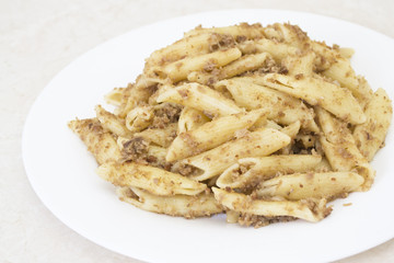 Italian penne pasta with chopped meat