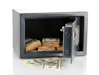 Naklejka premium Money in open safe isolated on white
