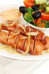 Grilled sausage with fresh salad close up