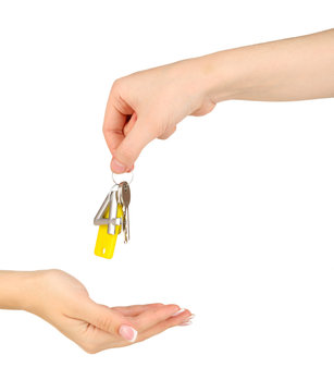 Transfer of house keys isolated on white