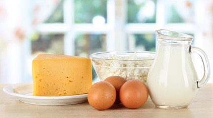 Dairy products and eggs on table in kitchen