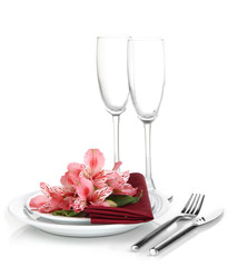 Festive table setting with flowers isolated on white