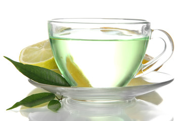 Transparent cup of green tea with lemon, isolated on white