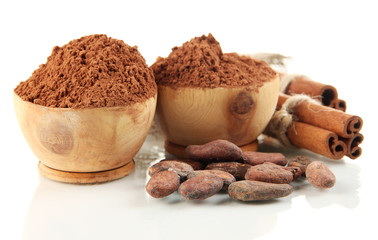 Cocoa powder in wooden bowls and spices, isolated on white
