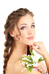 Fototapeta premium Young woman with beautiful hairstyle and flowers, isolated