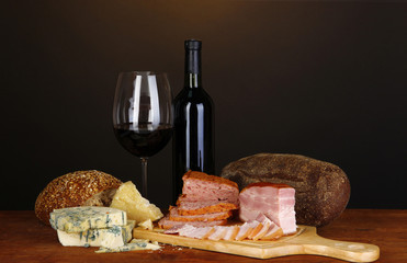 Exquisite still life of wine, cheese and meat products