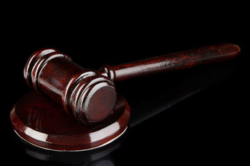 Wooden gavel on black background