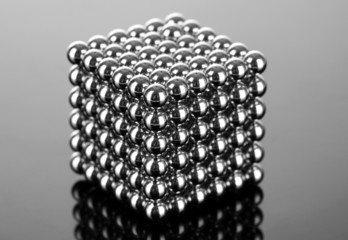 Neocube (toy) on dark grey background