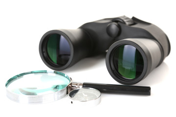 Black modern binoculars with magnifying glass and compass