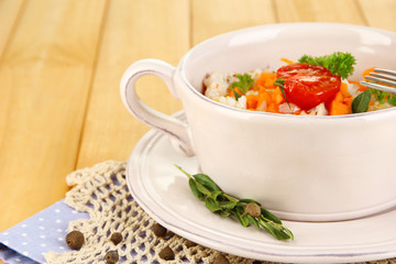 Delicious rice with vegetables and herbs in pot