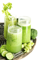 Glasses of green vegetable juice, isolated on white