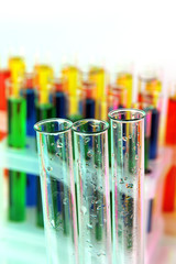 Empty and colorful test tubes close-up