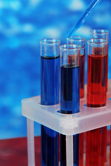 Blue and red test tubes close-up