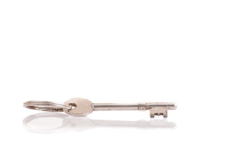 Old key on white background.