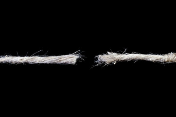 Torn rope isolated over black