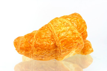 Fresh and tasty croissant over white background