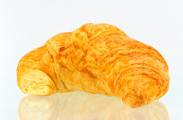 Fresh and tasty croissant over white background