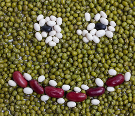smiling face made from a variation of dried beans
