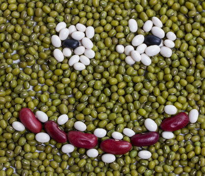 smiling face made from a variation of dried beans