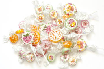 Colorful candy lollipops on white background