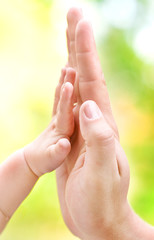 Man giving high five to his little son