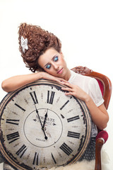 Portrait of a beautiful girl with a big English clock