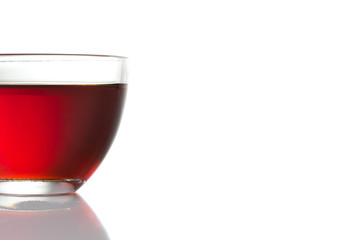 Glass cup of tea on a white background