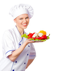 Nice woman cook holding a plate with fresh vegetables