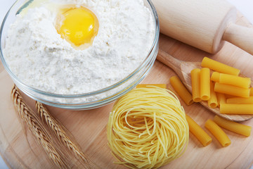 Bakery ingredient. Flour with raw eggs for making dough on the w