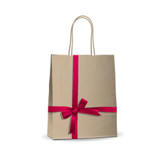 Empty shopping brown bag with  tied pink ribbon
