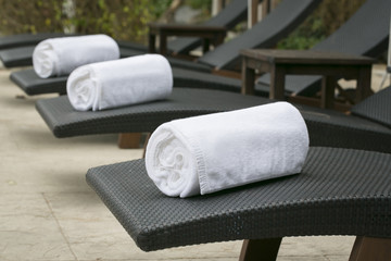 Rolled up white spa towels