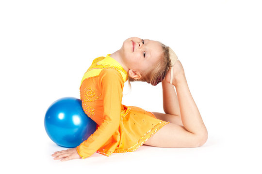 Beautiful girl gymnast with a ball