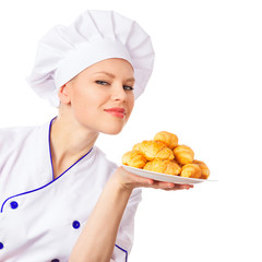 European cook woman showing a plate of made pastries