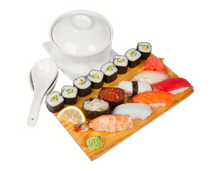 Sushi set on board isolated on white