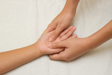  children massage with mother hand