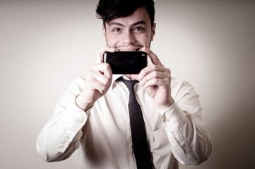 Fototapeta premium businessman taking photo with telephone