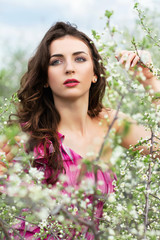 Naklejka premium Thoughtful young curly brunette
