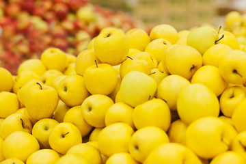 golden apple on the shelf in the supermarket
