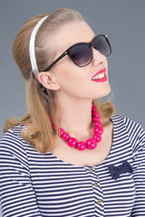 portrait of attractive pinup girl in sunglasses