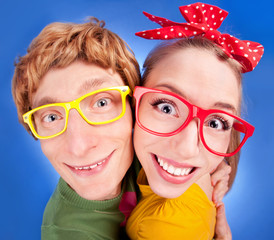 Happy nerdy couple embracing