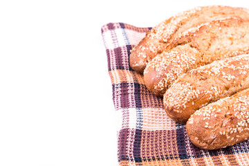 Freshly baked bread rolls with sesame